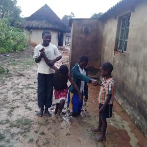 Children playing in the mud left by Cyclone Idai